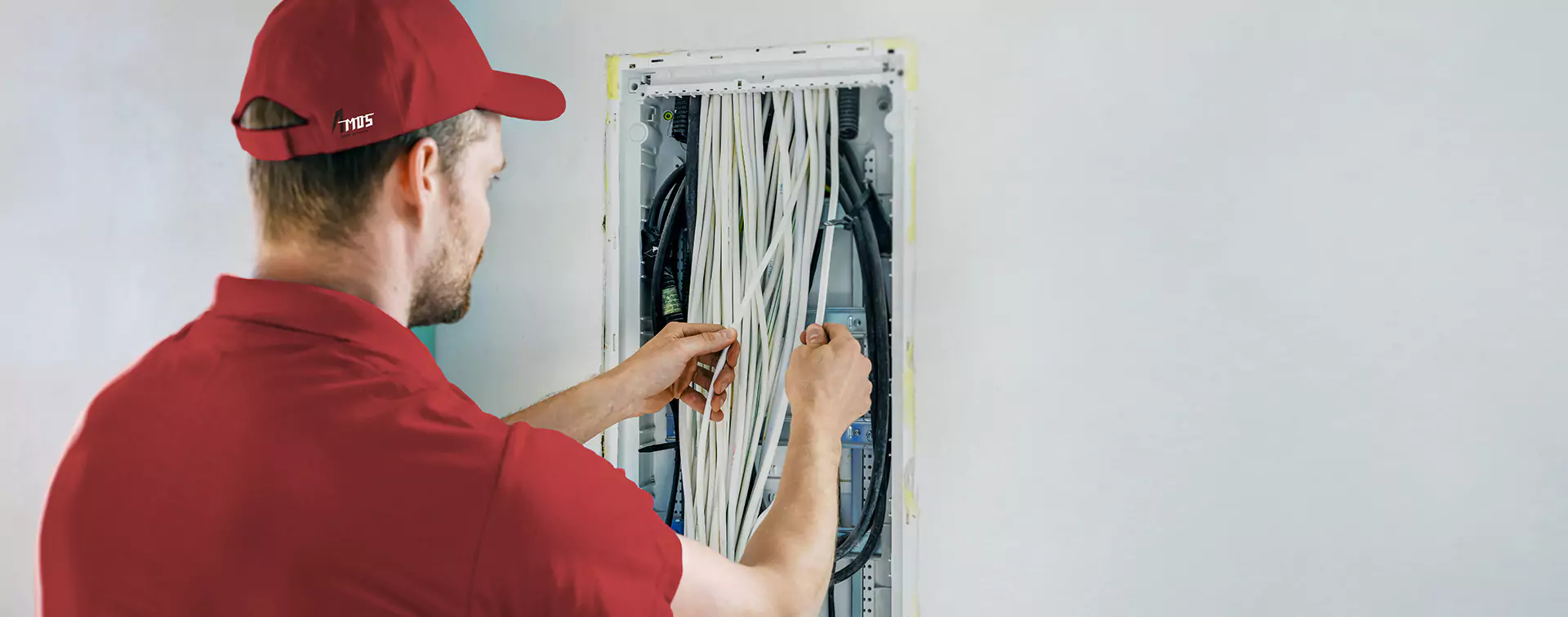 A Person Working on Wires | Electrical Services