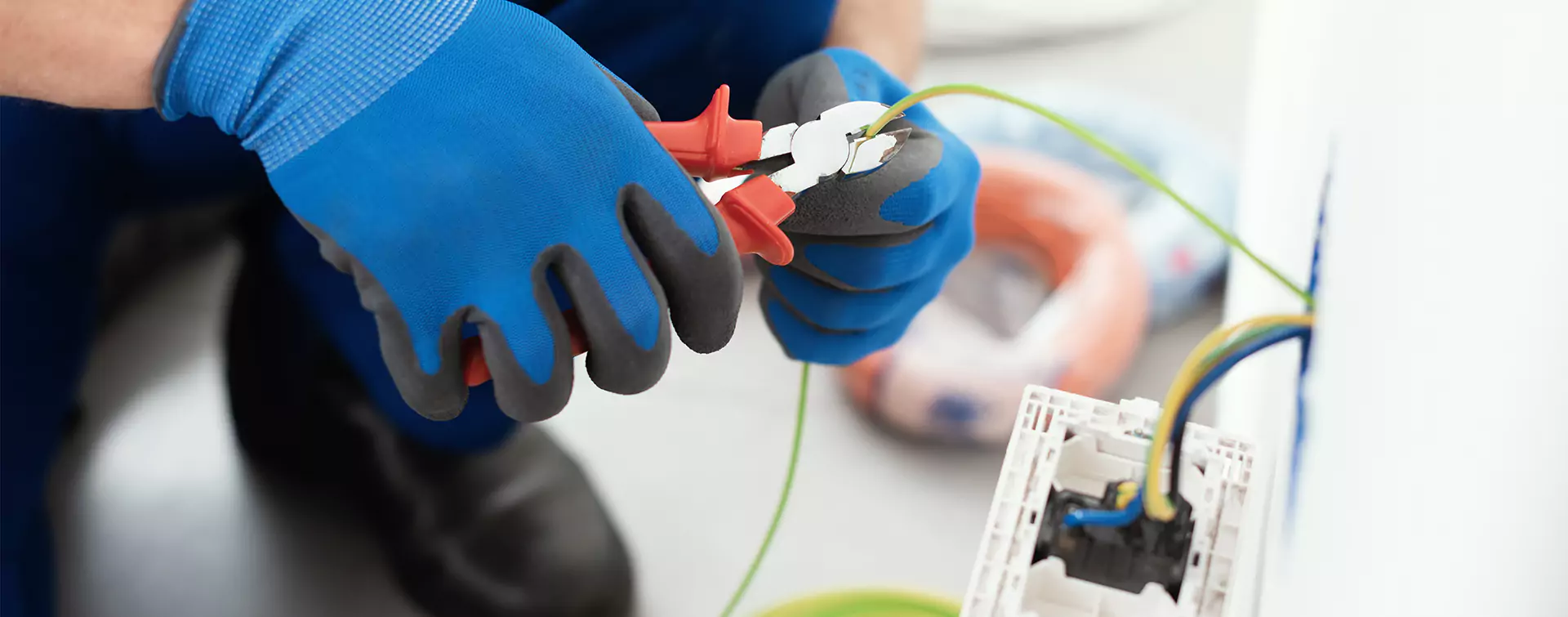 Hands Holding Pliers | Electrical Services