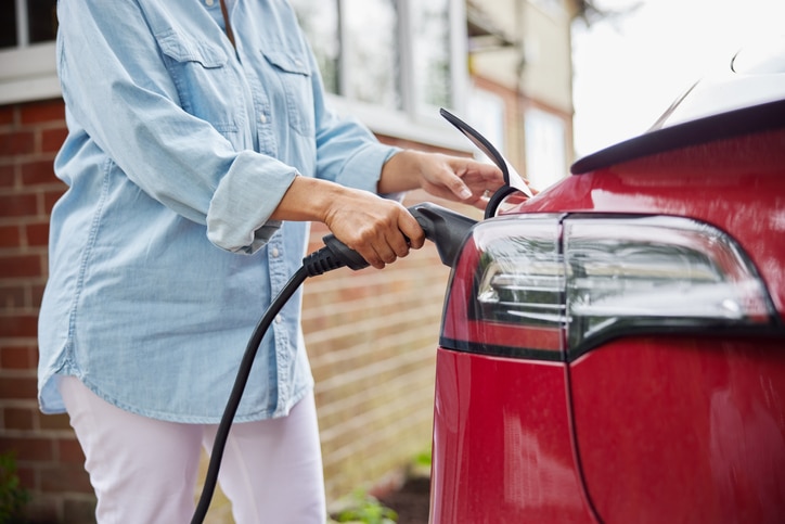 Woman Attaching Charging Cable
