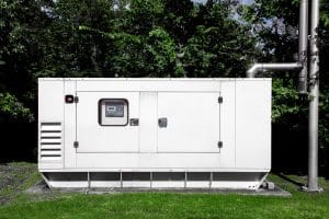 emergency generator mounted on a green lawn